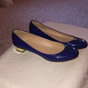 Blue dress shoes with gold heel